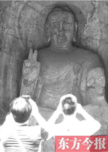 洛陽龍門石窟“剪刀手”佛像走紅 專家稱實(shí)屬巧合